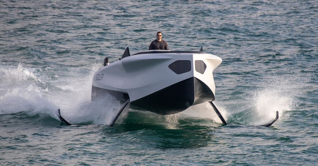 Folier flying yacht moving at speed on foils