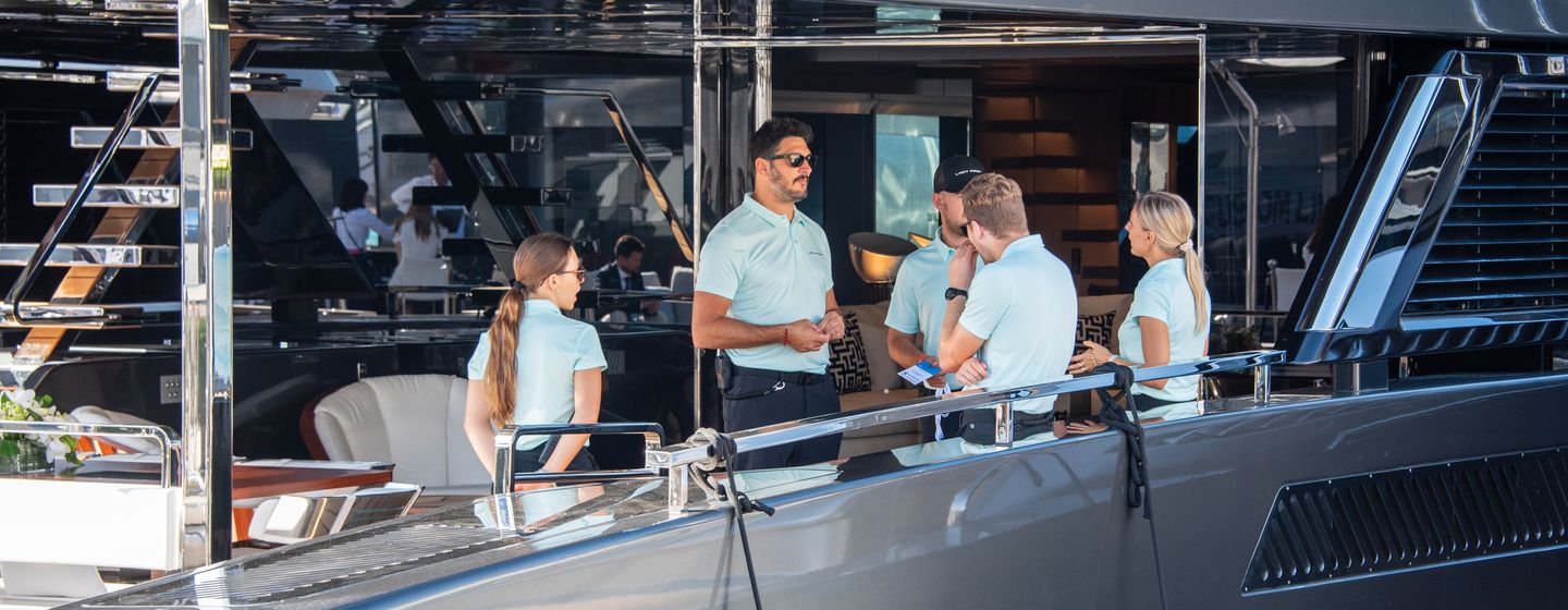 Professional yacht crew working on a superyacht