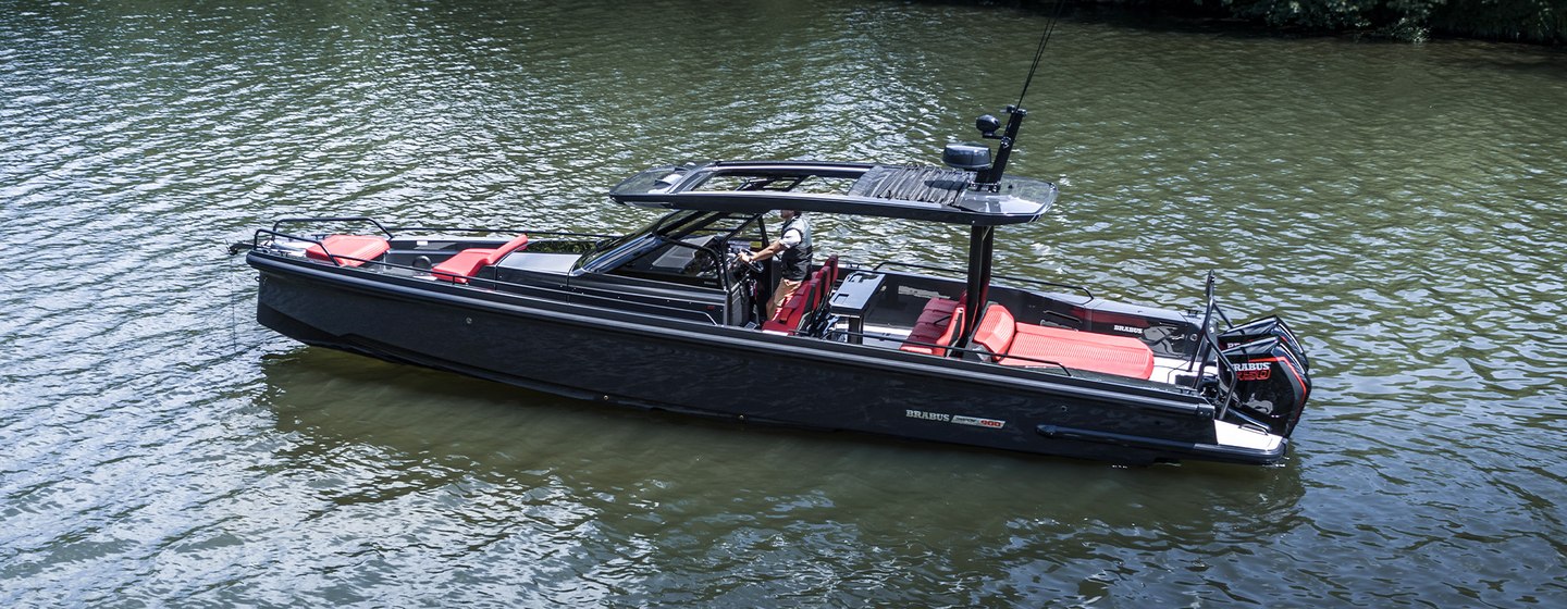 Chase boat on water with bushes in background