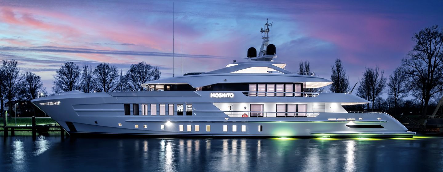 Superyacht MOSKITO on water at night