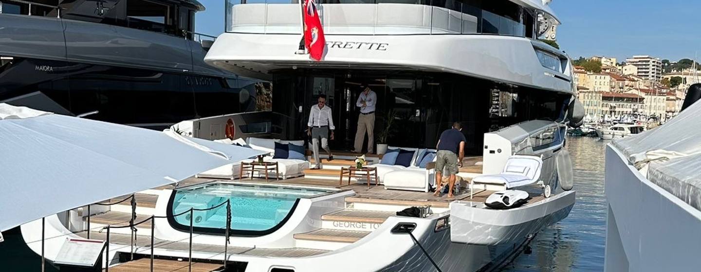 FRETTE Columbus Atlantique 43 on show at her stand in Cannes Yachting Festival Vieux Port, sunny day, shot taken from pontoon looking down starboard side