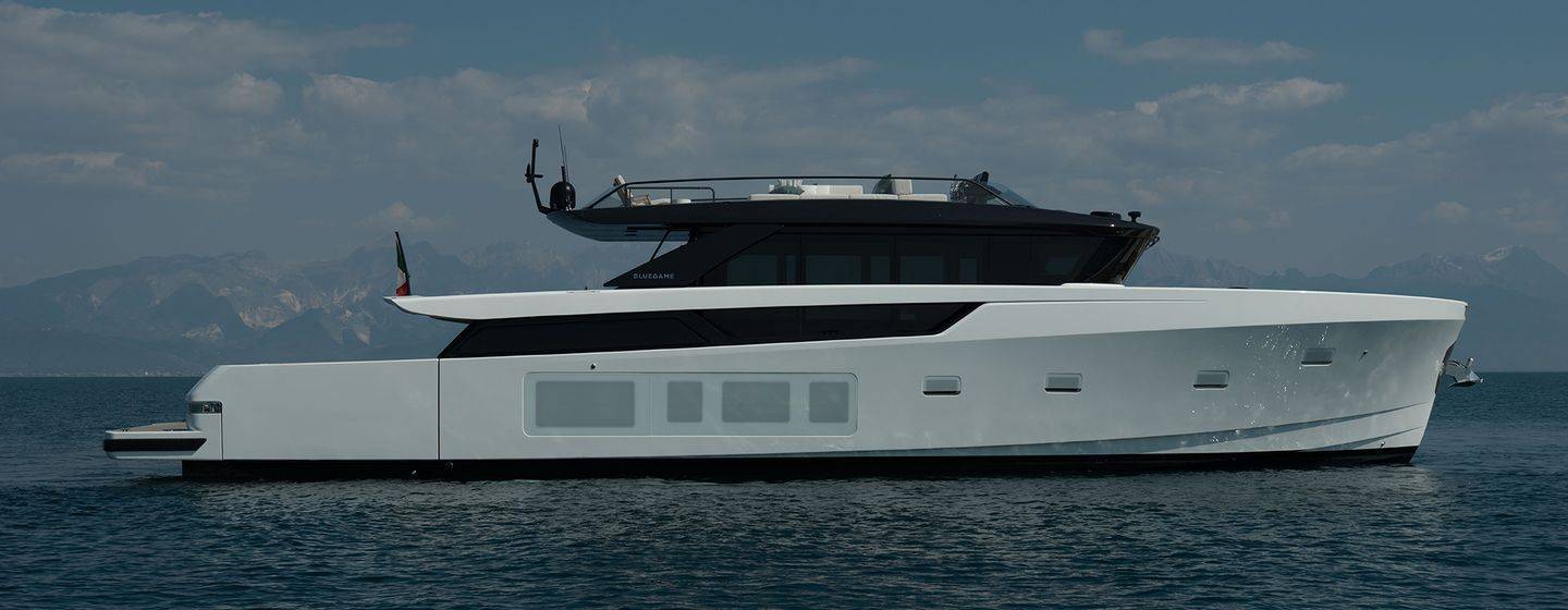 Bluegame BGX83 motor yacht at anchor side view 
