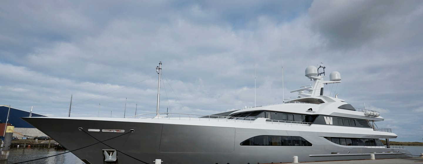 Feadship superyacht W anchored at the Feadship shipyard facility