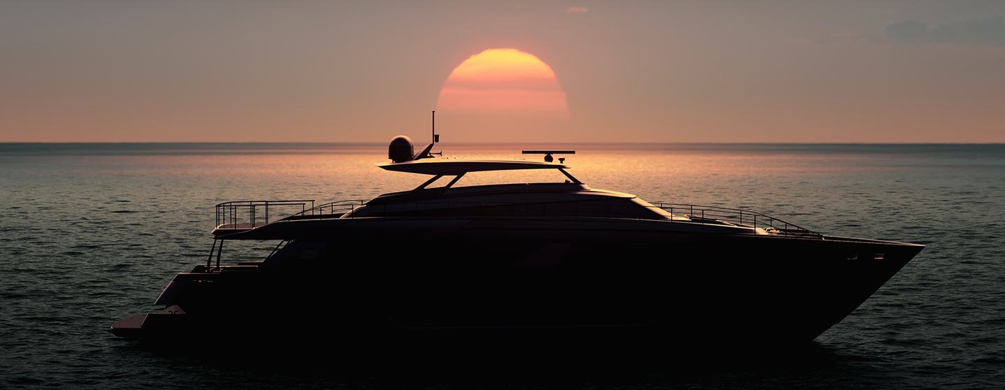 silhouette of Ferretti Yachts' superyacht 1000 at anchor on calm waters as the sun sets