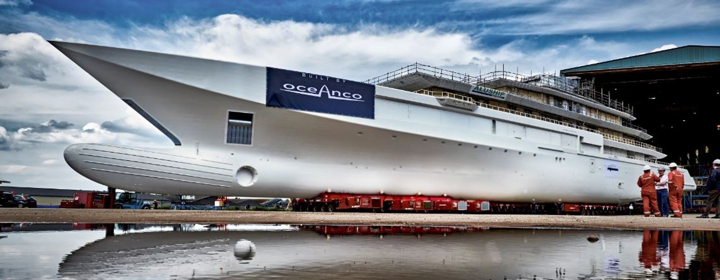 Oceanco Y720 superyacht leaving construction area, with cloudy sky in background