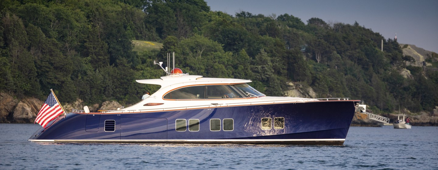 New Zeelander Z72 on water with hills in background