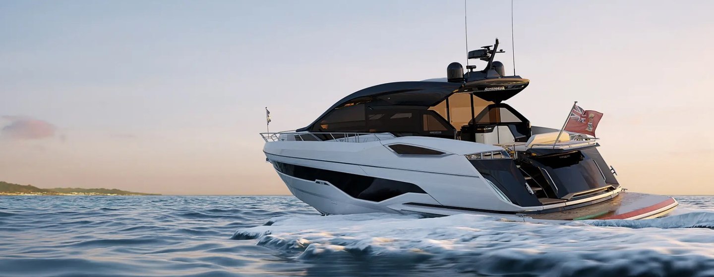 Sunseeker running yacht with image taken from water level to port side quarter deck, red ensign flag flying