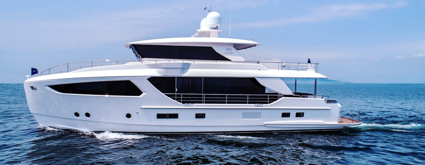 Side view of Horizon Yachts FD80 underway, surrounded by sea and blue sky.