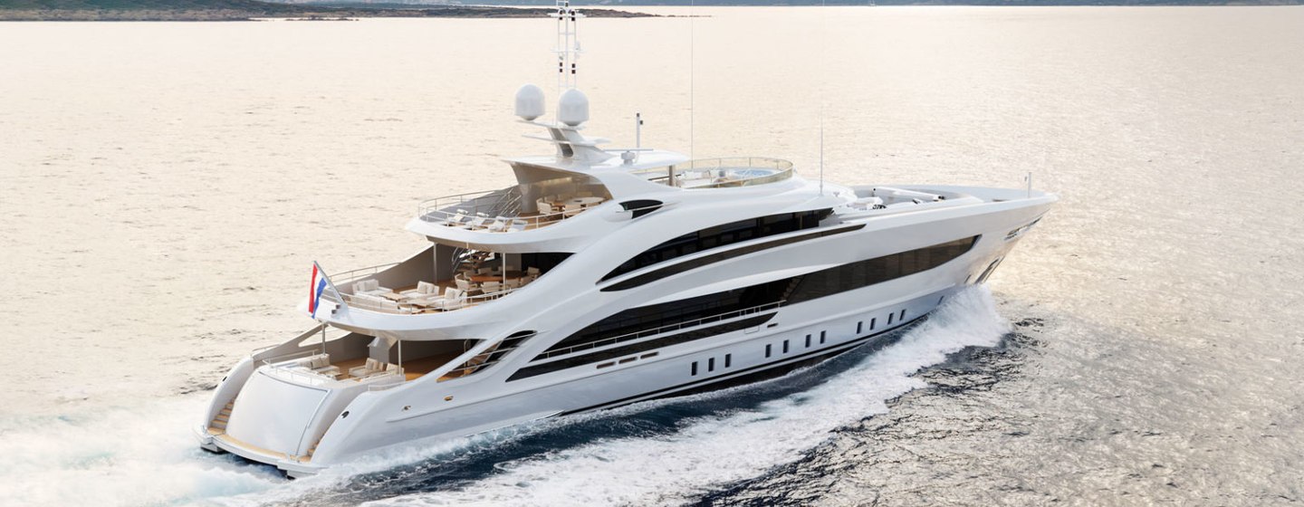 Heesen Project Aura underway, surrounded by sea and eleveated terrain in far distance