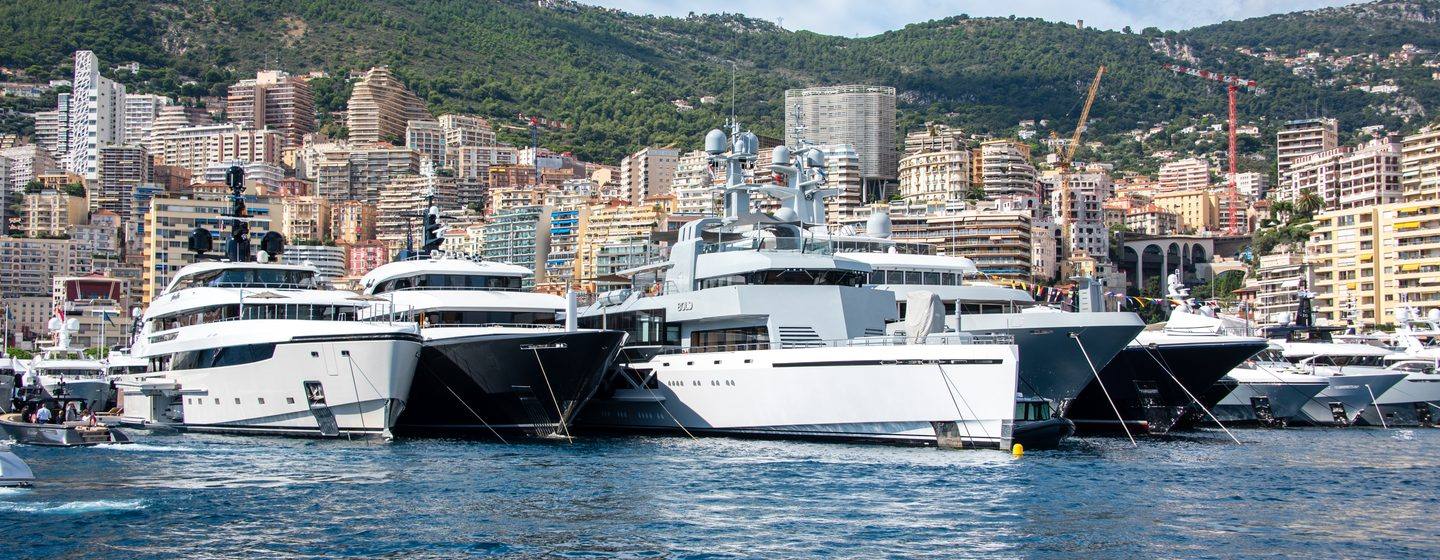 Monaco Yacht Show boats at anchor in a row 