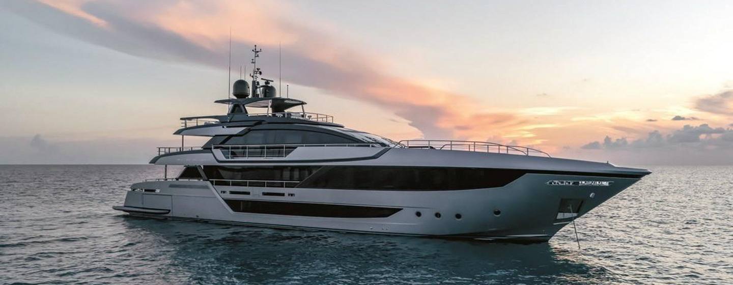 Riva motor yacht Janus Navem at anchor side view 