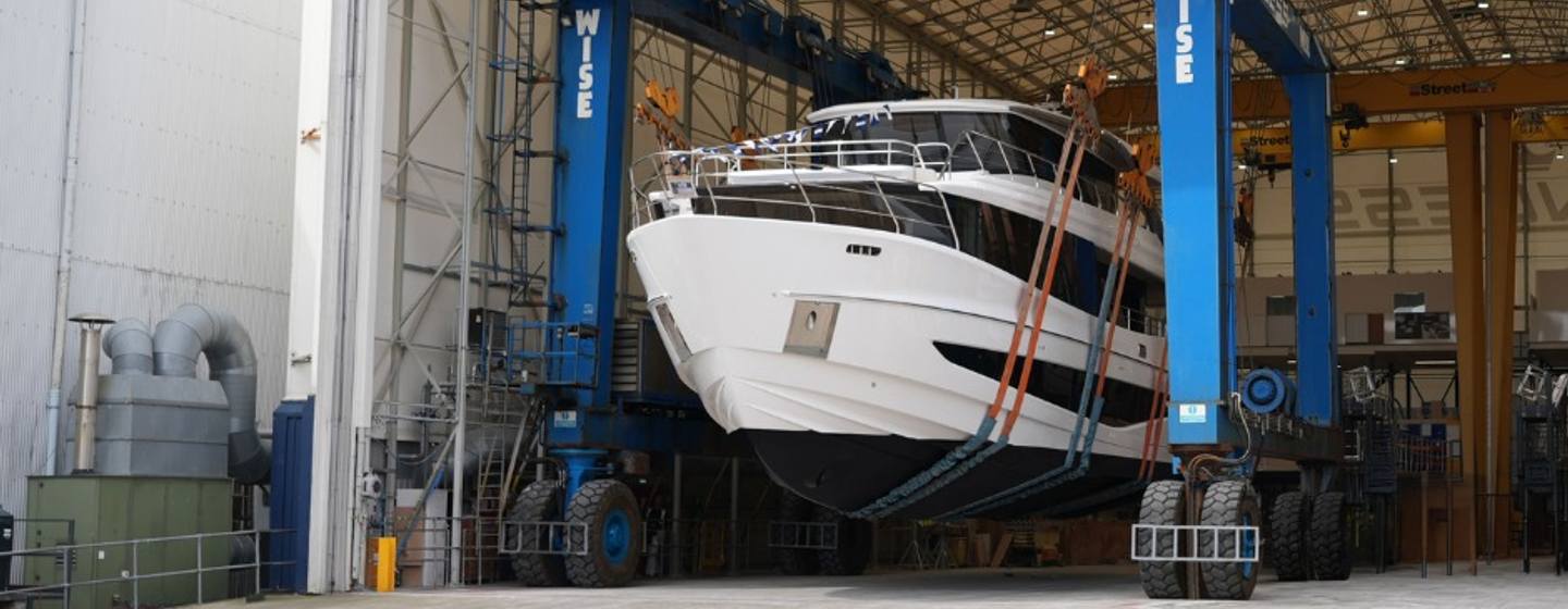 Princess X90 motor yacht leaving shipyard  on way to launch
