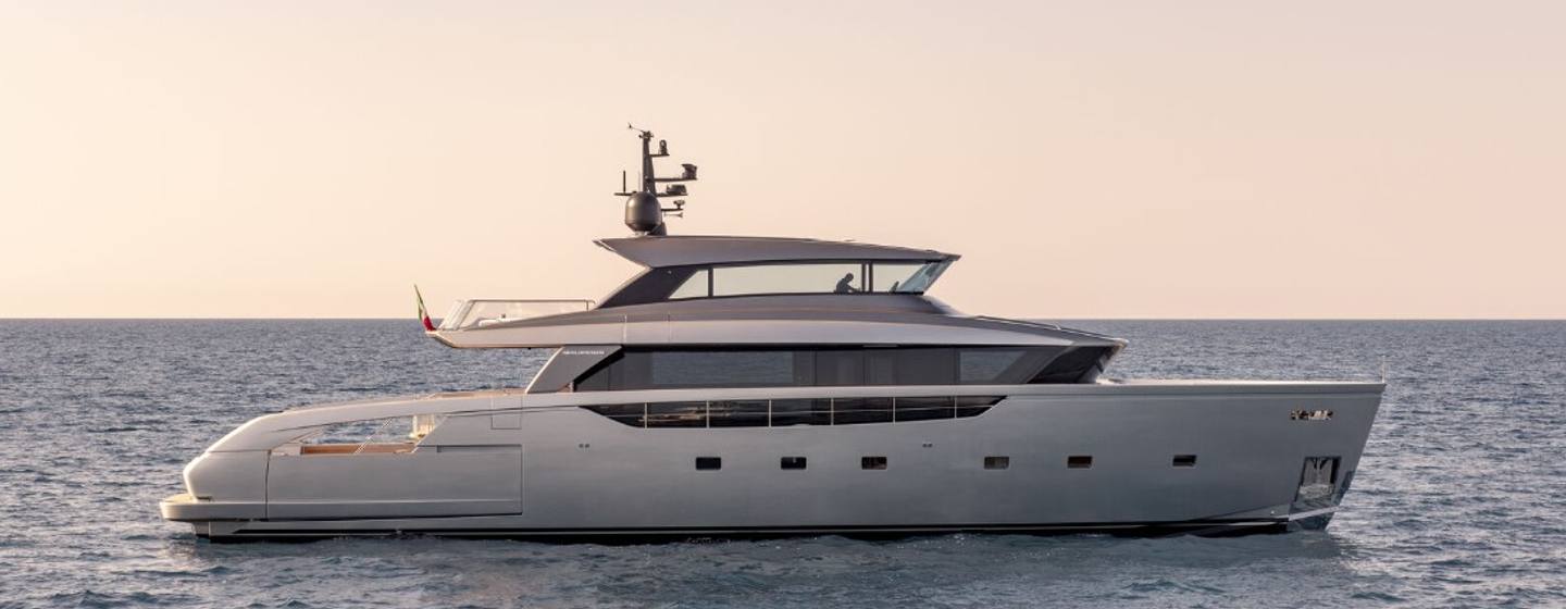 A side view of the Sanlorenzo SX100/123 superyacht out at sea during dusk