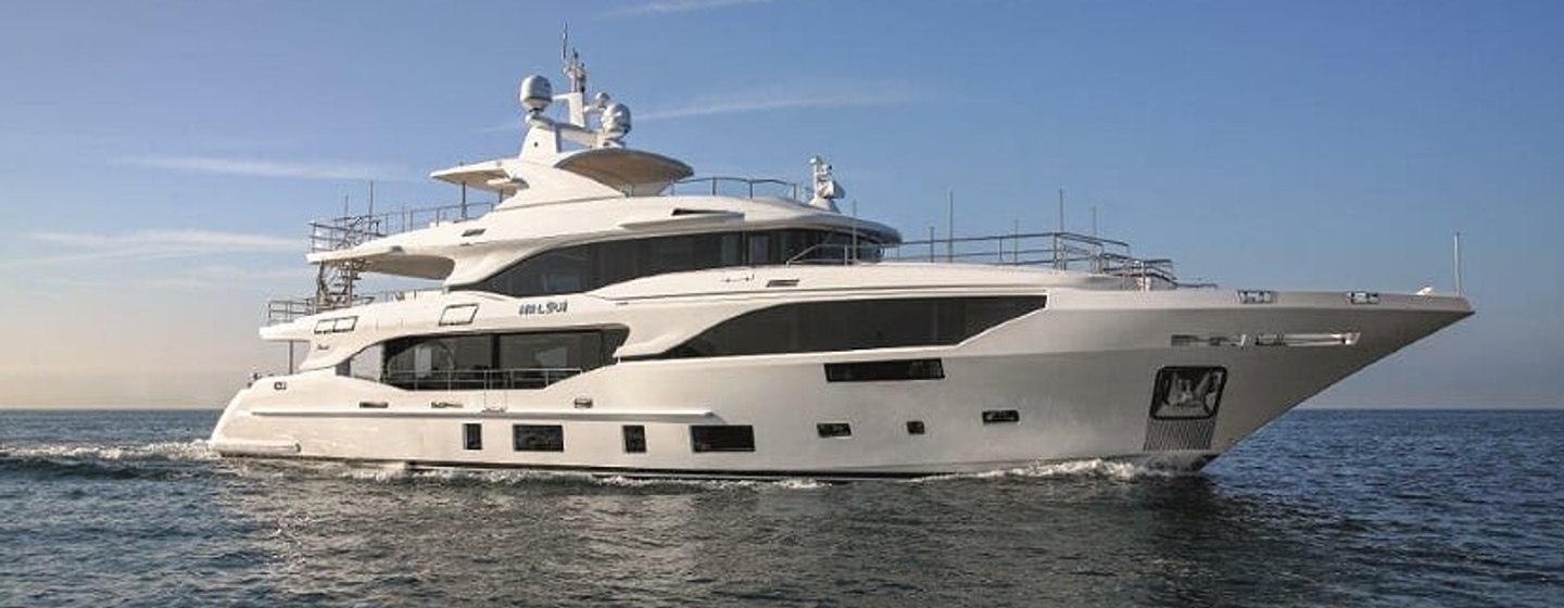 Motor yacht LOUI underway, surrounded by sea