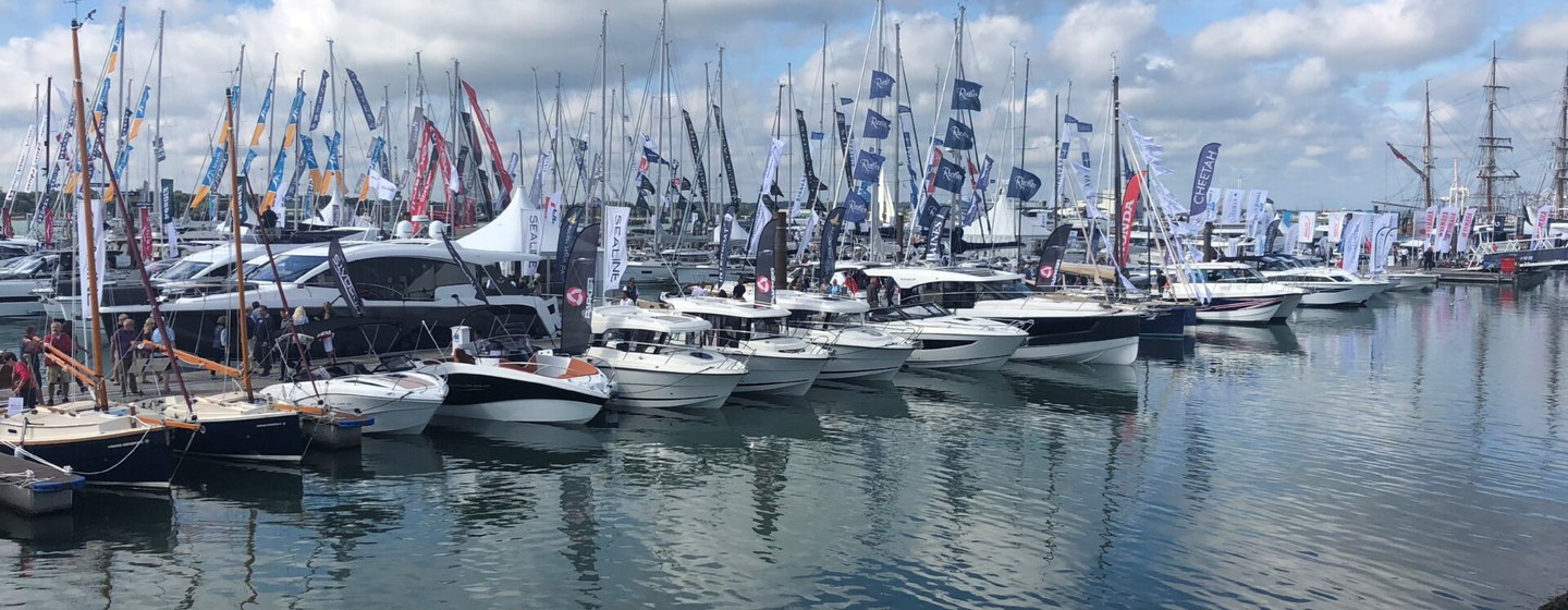 Overview of Southampton International Boat Show, line up of motoryachts and sailing boats moored