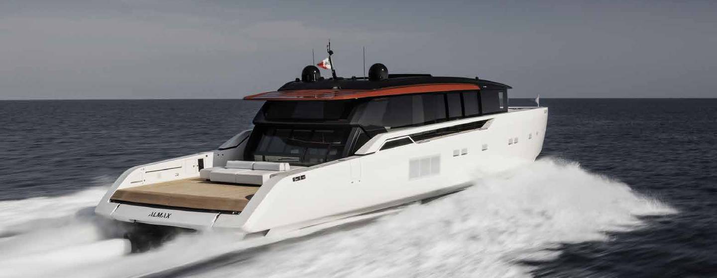 A starboard-side view of the Sanlorenzo SP110 cutting through grey seas