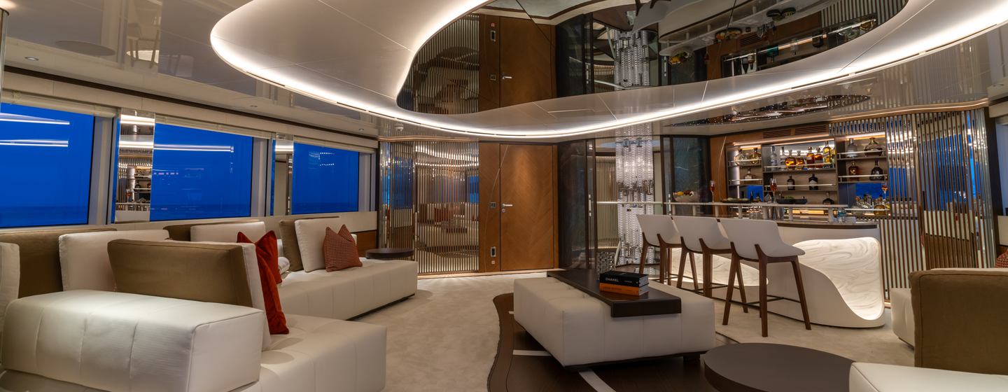 Superyacht Eternal Spark skylounge with circular lighting and white bar area 
