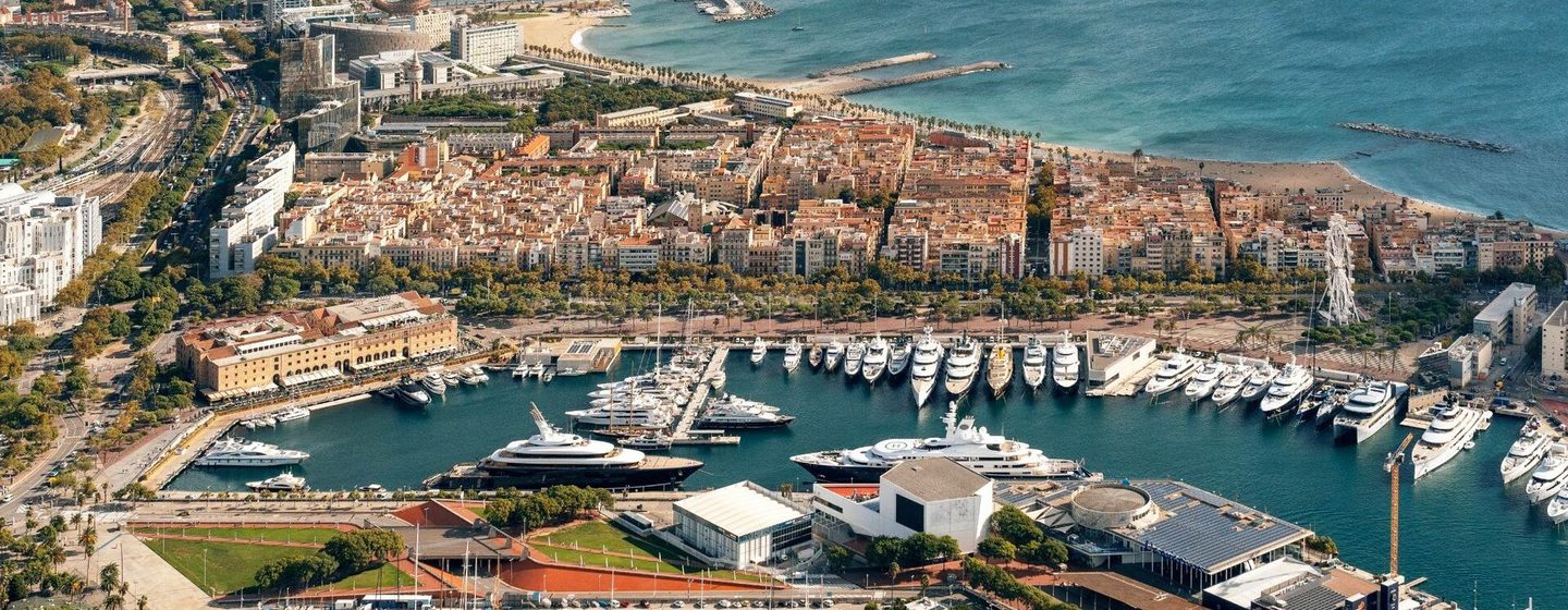 Aerial view of  Marina Port Vell with multiple superyacht docked 