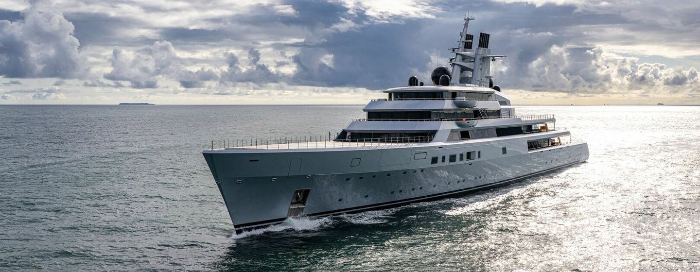 A port-side view of Lurssen superyacht Project ALI BABA making way through calm seas