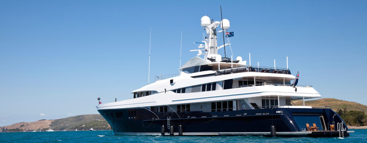 Superyacht at anchor stern view 