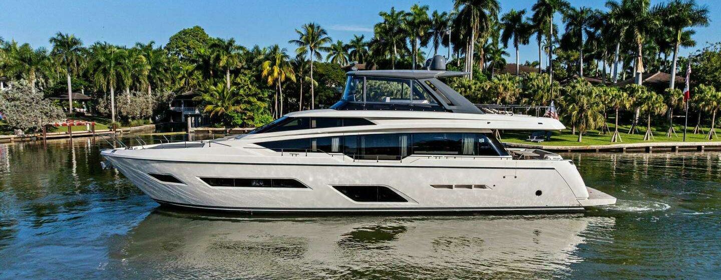 Ferretti 780 Motor Yacht Sunsation under way in front of palm trees 