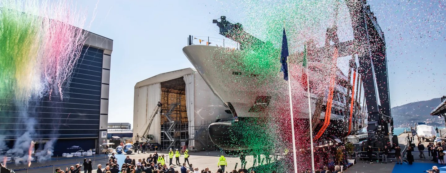 First 60m Baglietto T60 superyacht at launch ceremony with team underneath and confetti 