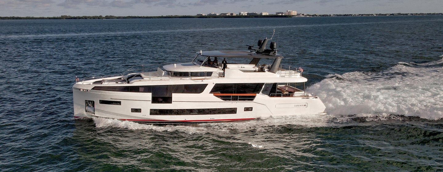 Motor Yacht Saint underway showing full side profile