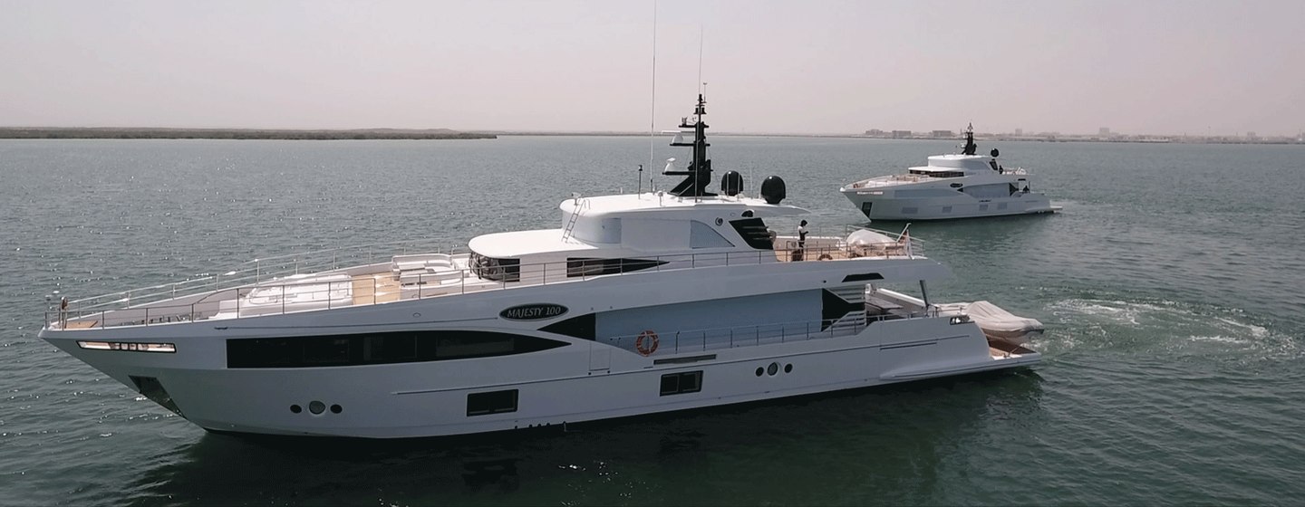 Two Majesty 100 yachts underway, surrounded by sea