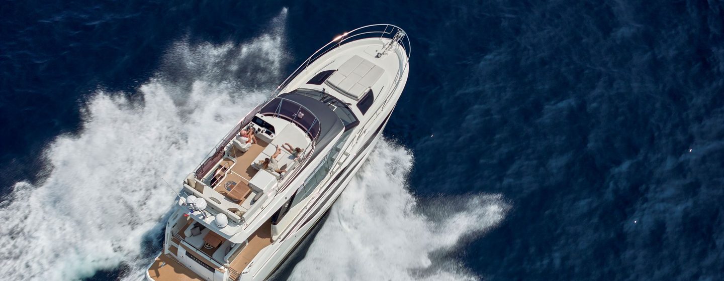 Prestige Yacht F4.9 aerial running shot, full power, over starboard aft deck