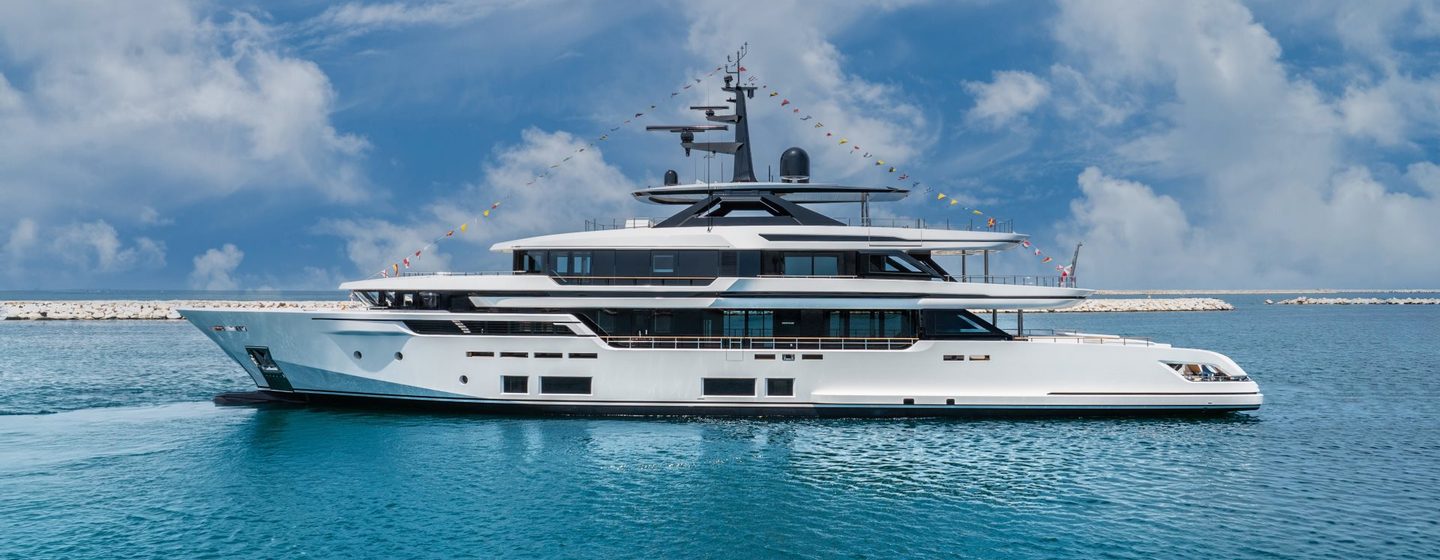  Custom Line 50 M/Y ASANTE shown port side profile on bright but cloudy day, calm waters