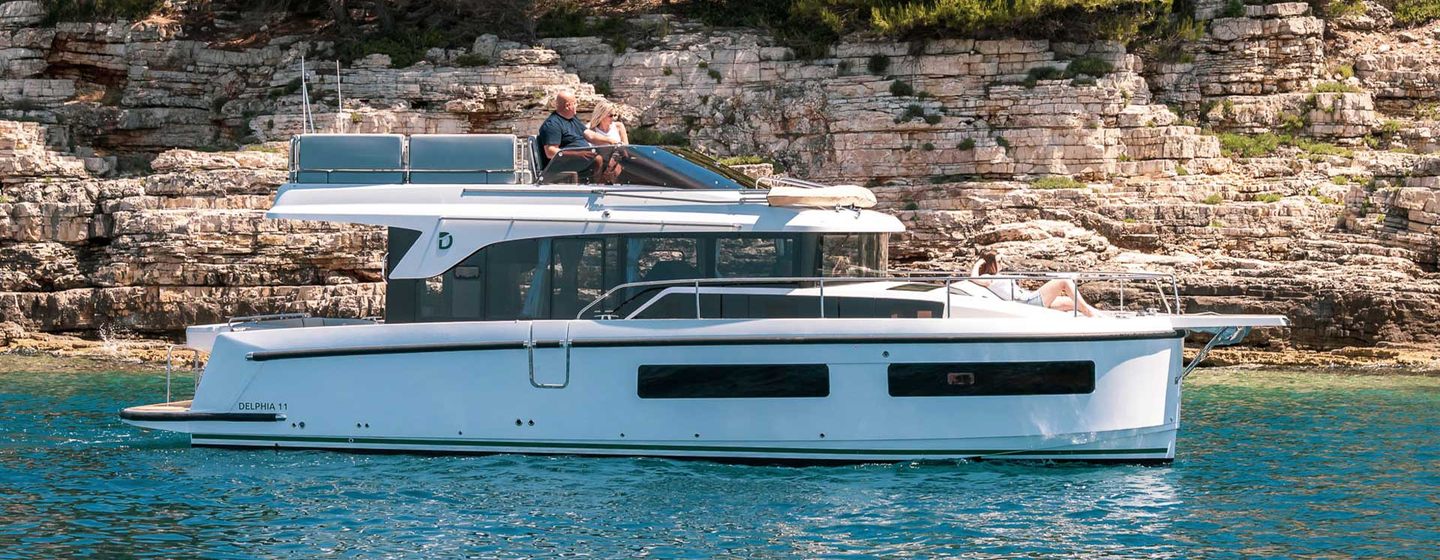 Updated Delphia 11 Flylounge Motor Yacht at anchor 