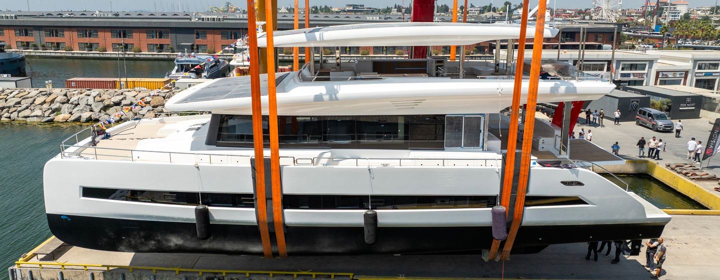 Second VisionF E-Cat 80 catamaran being lowered onto water at launch