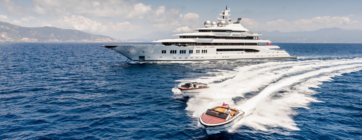 Pair of tenders racing past superyacht Amadea