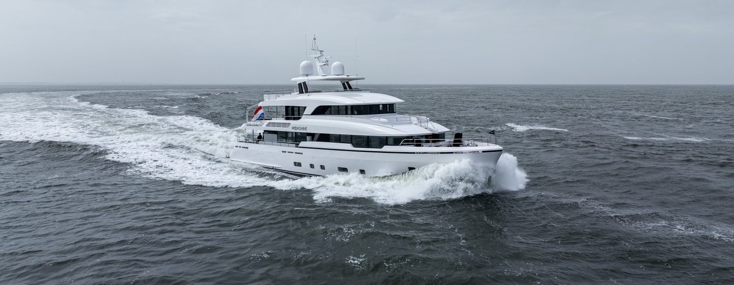 Motor yacht MOONSHINE underway at sea on a cloudy day