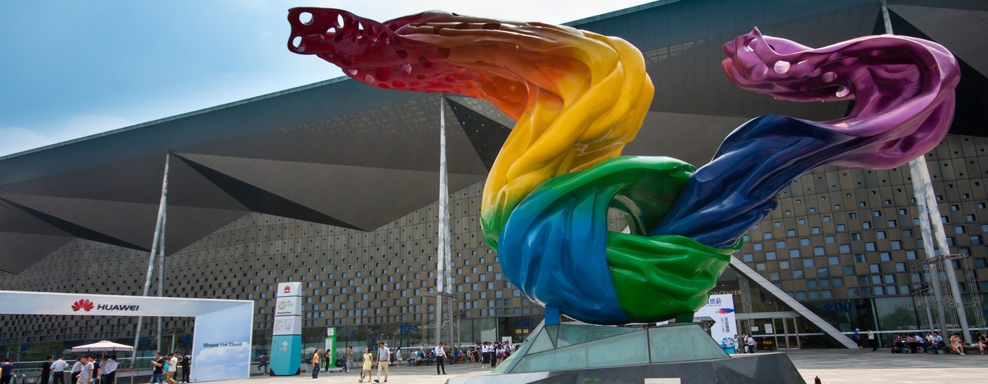 Shanghai World Expo Exhibition and Convention Centre with display in front of it