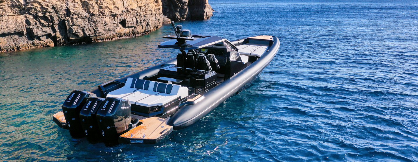 Technohull Alpha 50 boat at anchor stern view 