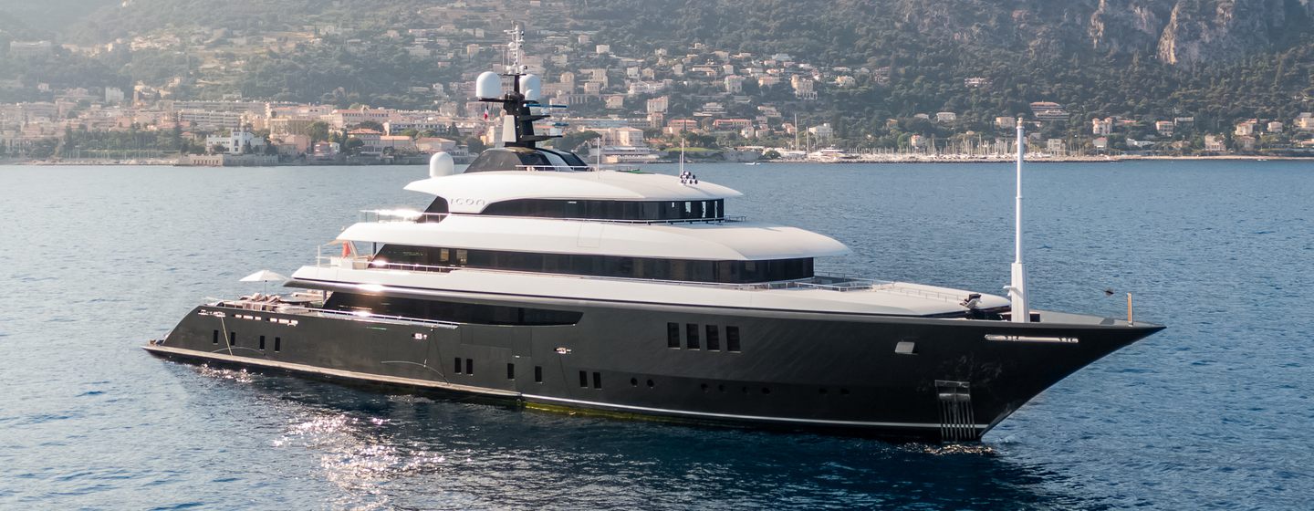 Motor yacht Loon at anchor on a sunny day