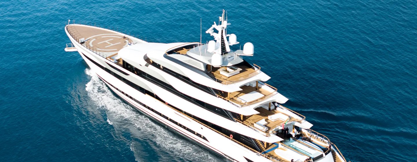 Admiral Yachts 78m PLATINUM shown in high aerial shot over port quarter deck and port side as yacht is making way in calm sea on bright day