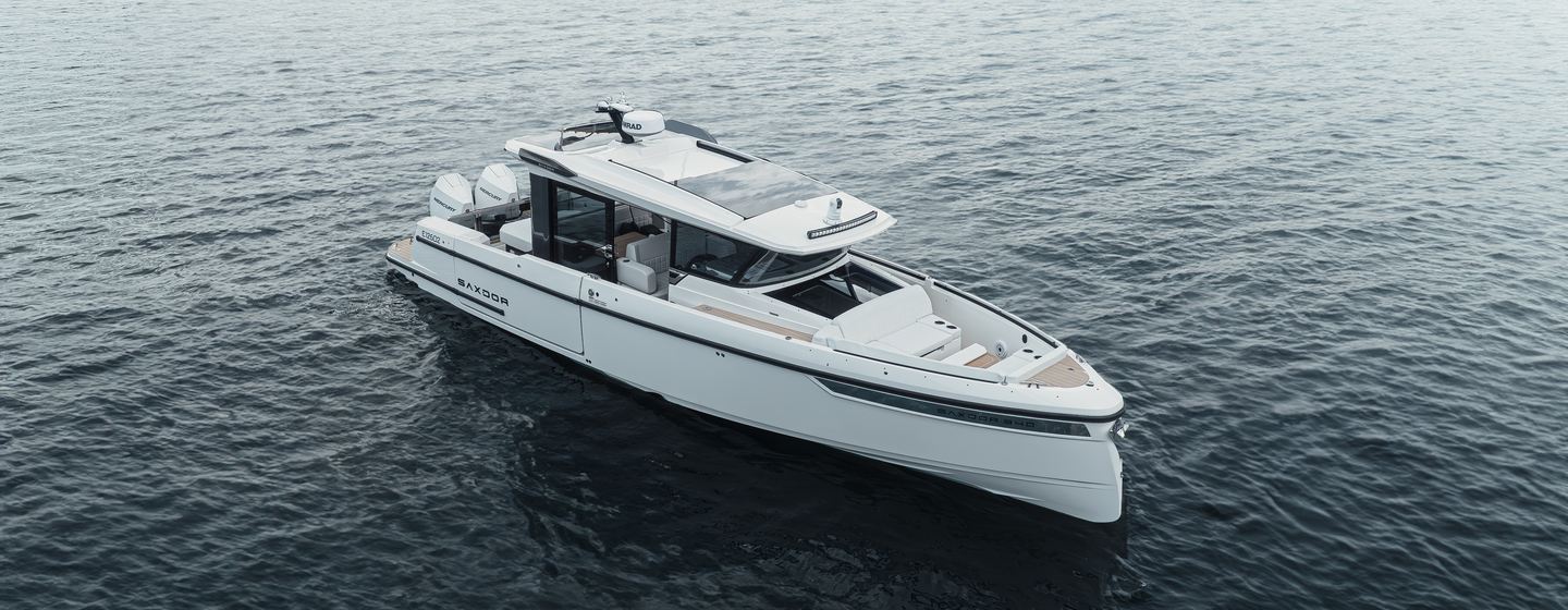 Saxdor mid aerial shot over starboard bow and side profile in calm waters on grey day