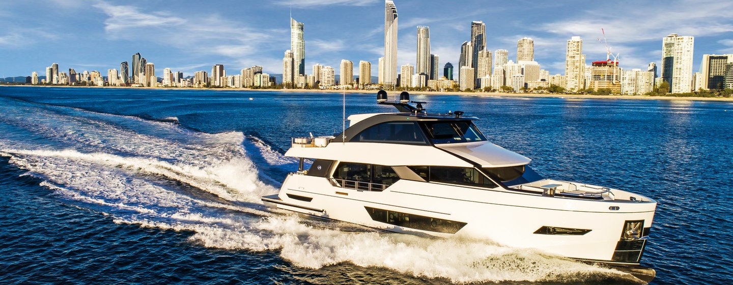 Ocean Alexander 26R on water with cityscape on horizon