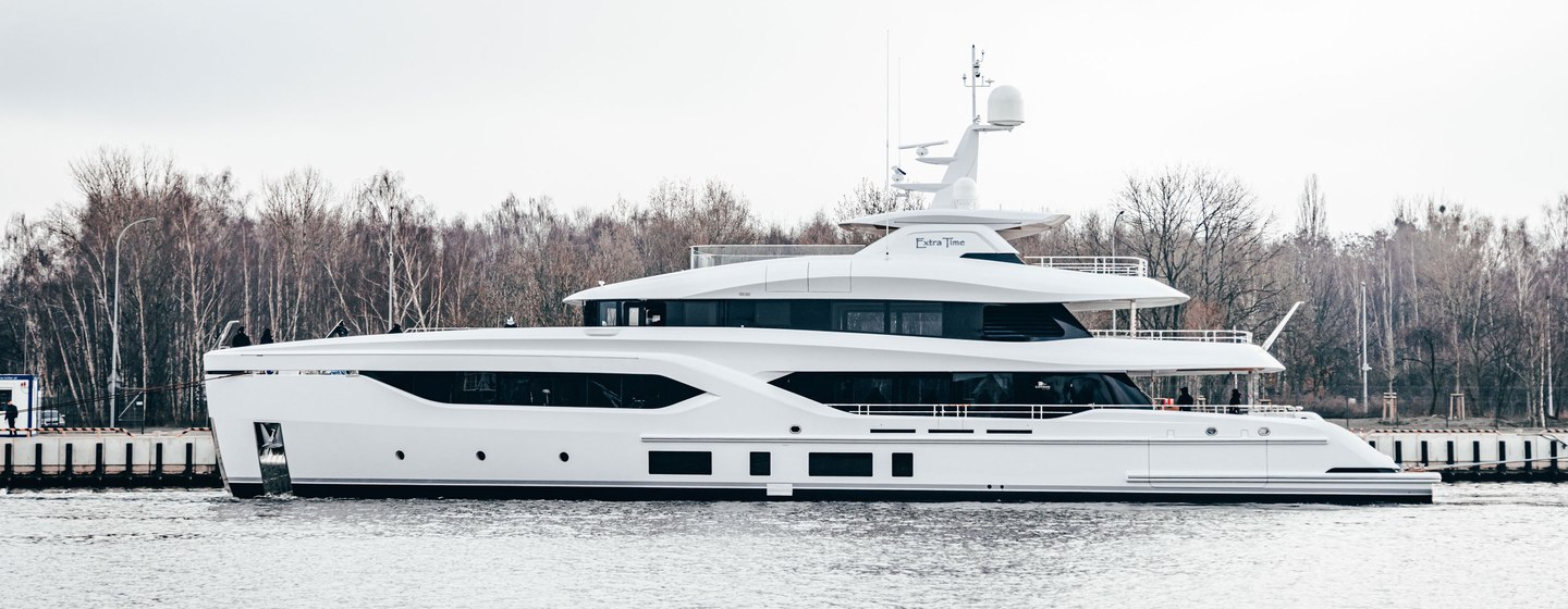 Conrad Yachts EXTRA TIME shown upon launch, port side profile, cloudy day