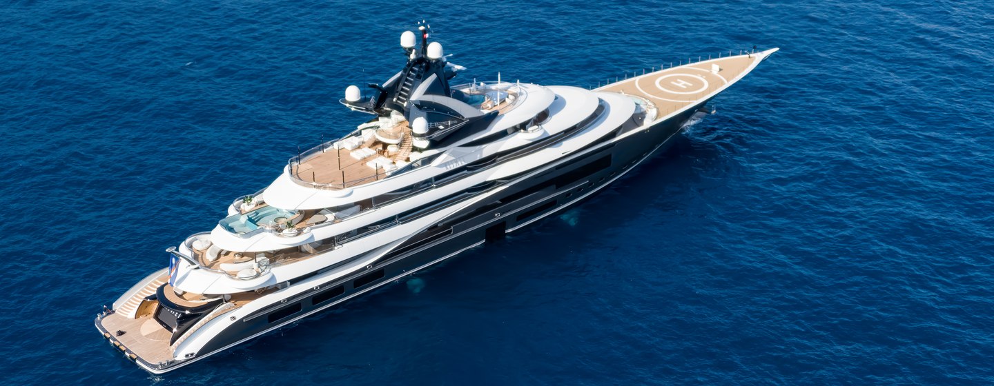 Kismet Lurssen yacht 2024 announced as Yacht of the Year aerial shot over starboard quarter deck and along side profile, blue sea