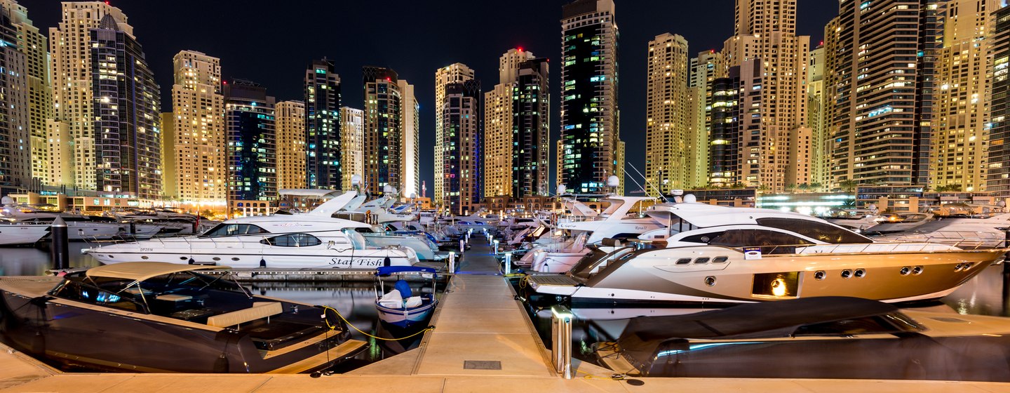 Yachts at night in harbour in Dubai