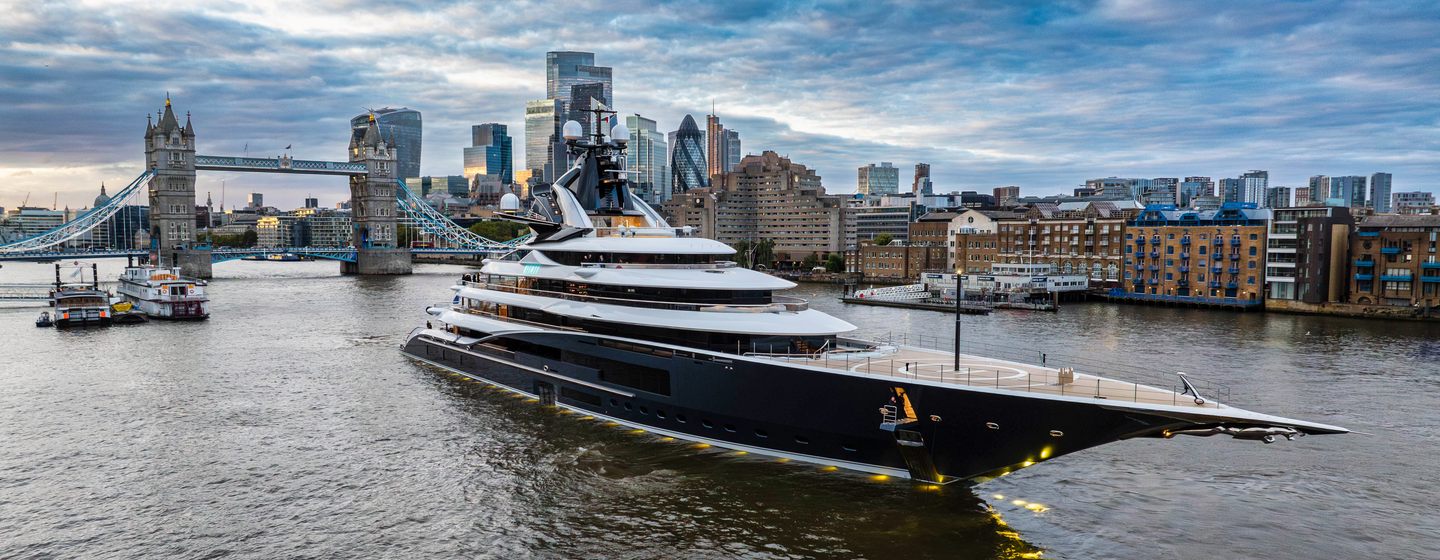 Kismet yacht moored in front  Tower Bridge with London skyline in the background