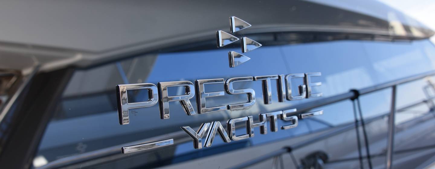 Prestige Yachts logo on side of yacht