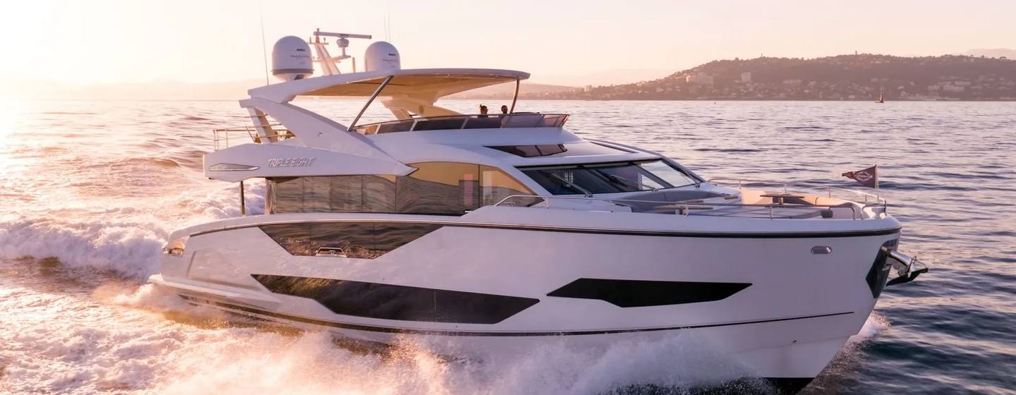 Motor Yacht Triple Eight underway at sunset showcasing dynamic performance and exterior design
