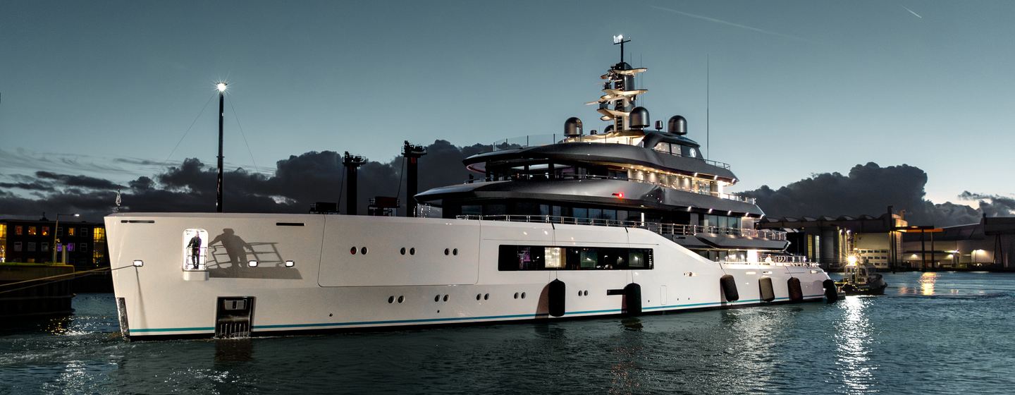 Superyacht Pangea docked at night 