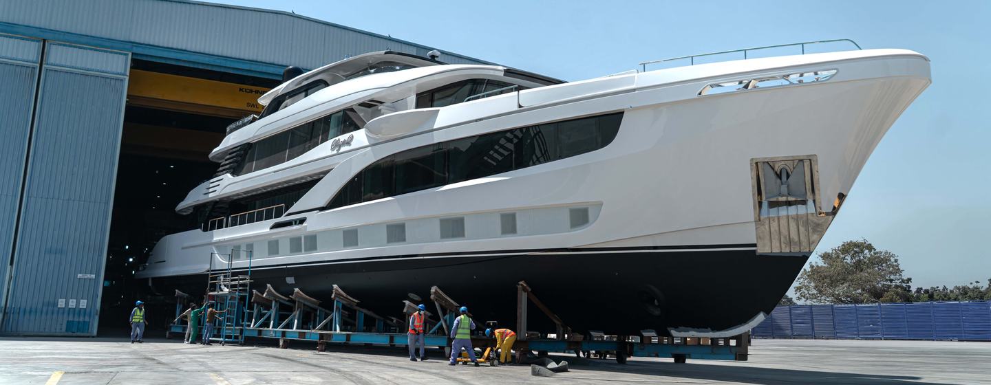 Gulf Craft Majesty 145 Superyacht Suzie Q on trolley with workers underneath on way to launch
