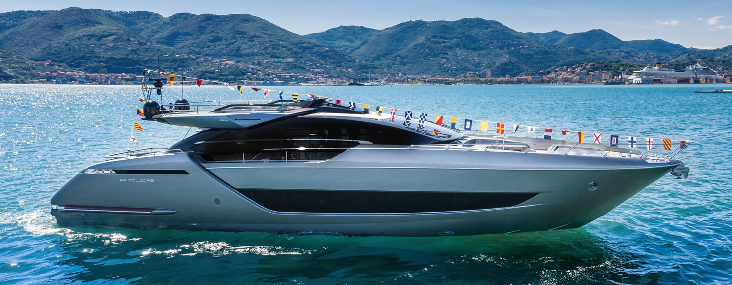 Riva 88' Folgore motor yacht at anchor side view 