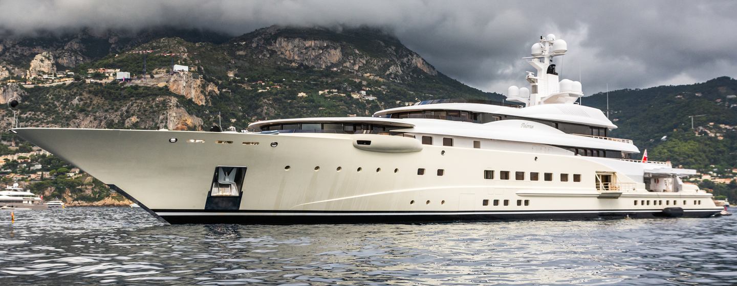 Superyacht Pelorus docked with stormy skies above 